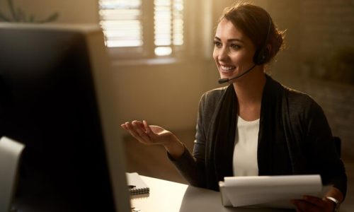 happy-customer-service-representative-using-computer-while-communicating-with-clients-online_637285-6679